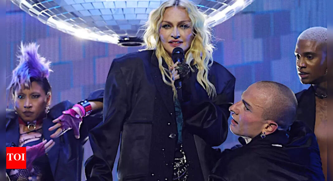 Madonna's Lawyer denies settlement in delayed concert Lawsuit English