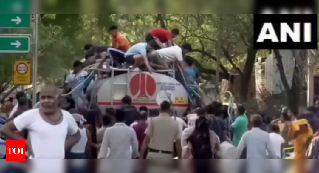 Watch: Desperate Delhiites in long queues for water amid crisis