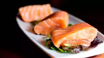 Is it safe to consume exotic delicacies made with raw Salmon?