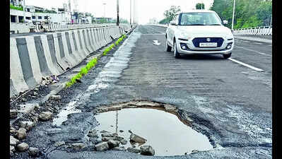 Potholes: Potholes on Dwarka junction flyover of Mumbai-Agra highway