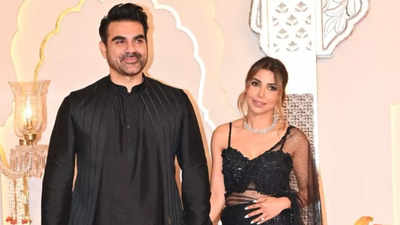 Arbaaz Khan and wife Sshura Khan hold hands while posing for paparazzi in their twinning black outfits at Anant Ambani-Radhika Merchant’s wedding - See photos