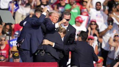 Former US President Donald Trump Rushed Off Stage During Rally After Apparent Gunshots