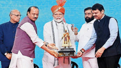 PM Narendra Modi with CM Eknath Shinde and DCMs Devendra Fadnavis and Ajit Pawar laying foundation stones for infra projects at NESCO Center PM flags off Rs 29,400cr infra projects in Mumbai, says his govt created 8cr jobs in 3-4 years