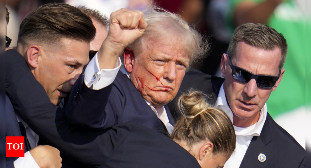 Photo of bloodied, defiant Trump takes on patriotic meaning – Times of India