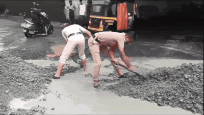 Cops fill potholes on busy Mumbai highway, Shiv Sena (UBT) MLA ...