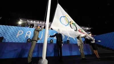 Paris Olympic flag raised upside down in rain-soaked opening ceremony