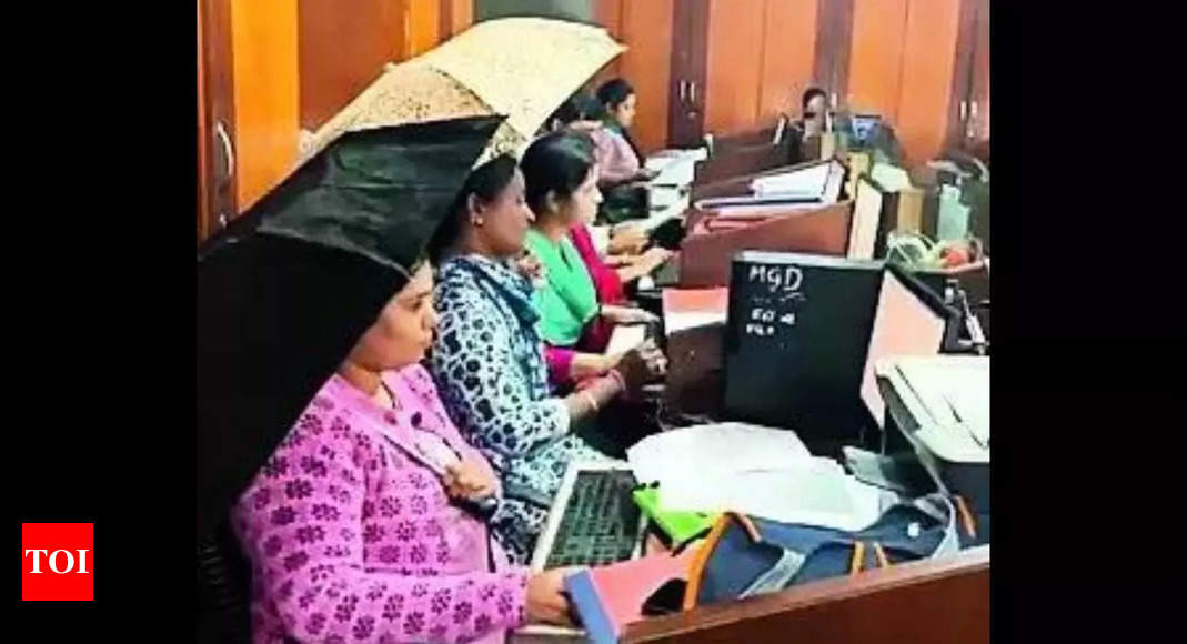 Umbrellas to rescue at leaky Haveri govt office in Karnataka