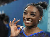 Simone Biles wears GOAT necklace