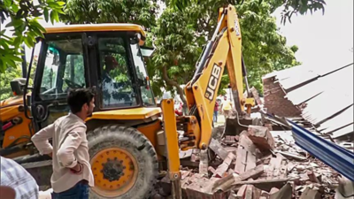 UP bulldozes 'illegal' bakery of SP neta accused of rape