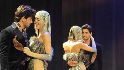 Netizens say, 'Kiara bhabhi will be waiting with slipper at home' as Sidharth Malhotra goes cosy with a model on the ramp - WATCH VIDEO