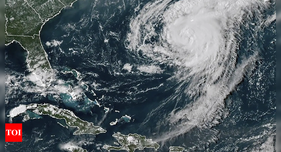 Hurricane Ernesto weakens to a tropical storm as it moves away from Bermuda over open waters