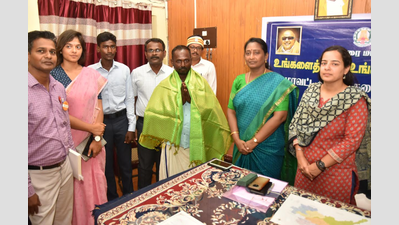 Madurai collector felicitates mason for his service to govt school