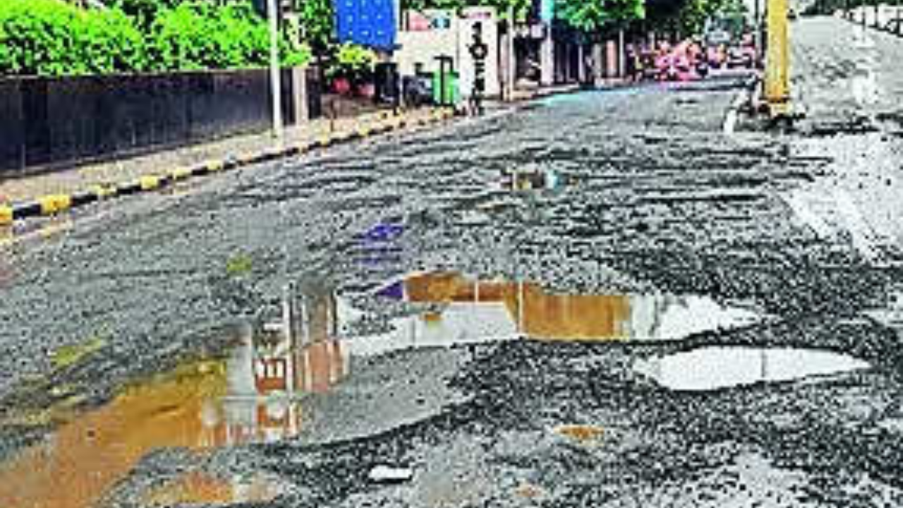 Ahmedabad's 50 roads in disrepair lead to rough rides for commuters |  Ahmedabad News - Times of India