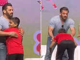 Salman Khan gives a hug to a young fan on stage