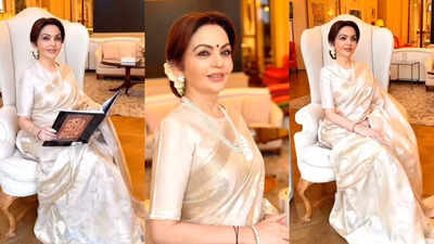 Nita Ambani stuns in ethereal white sari with exquisite floral patterns and golden borders