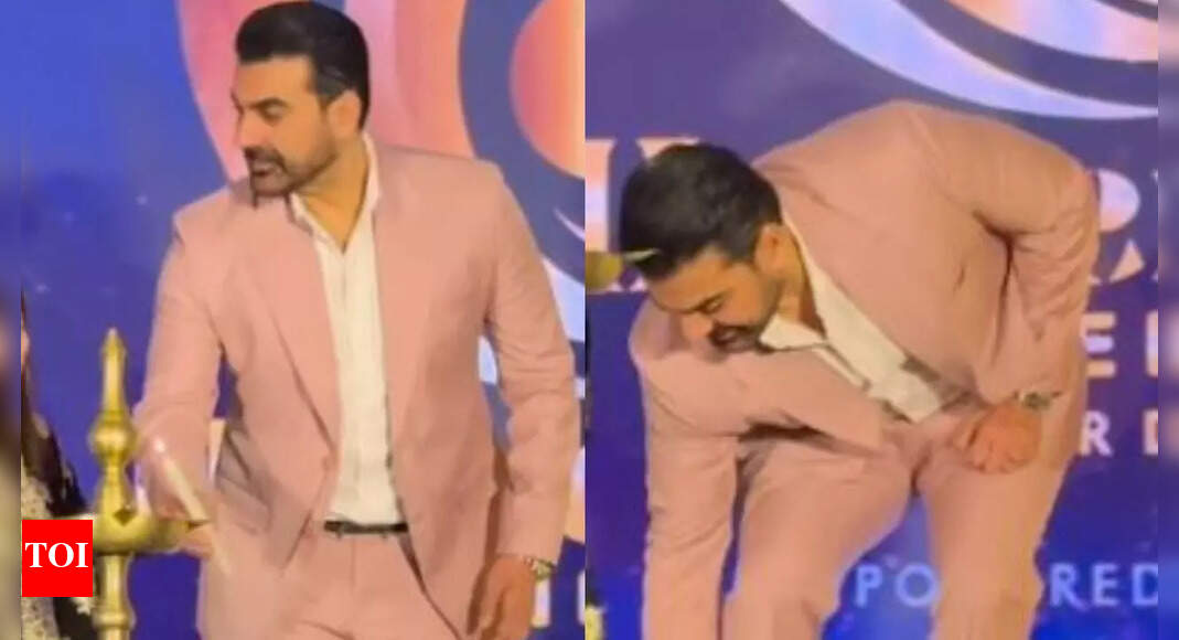Arbaaz gestures towards removing shoes before this