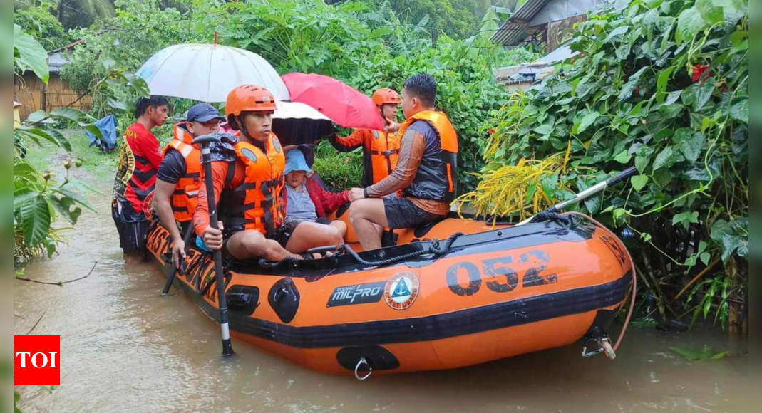 Storm floods northern Philippine regions, including capital, disrupting schools, work and travel – Times of India