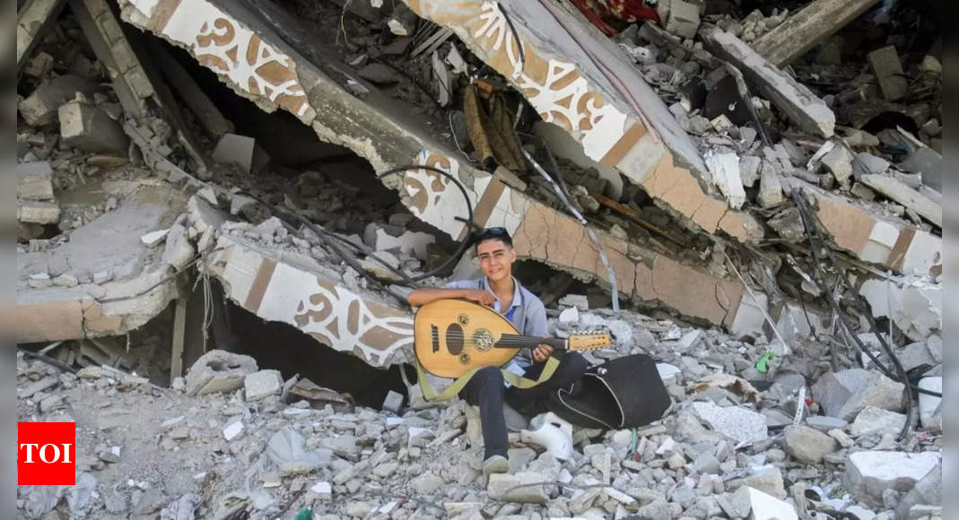 Gazan teen musician found new life in playing his oud for children amid war, watch video – Times of India