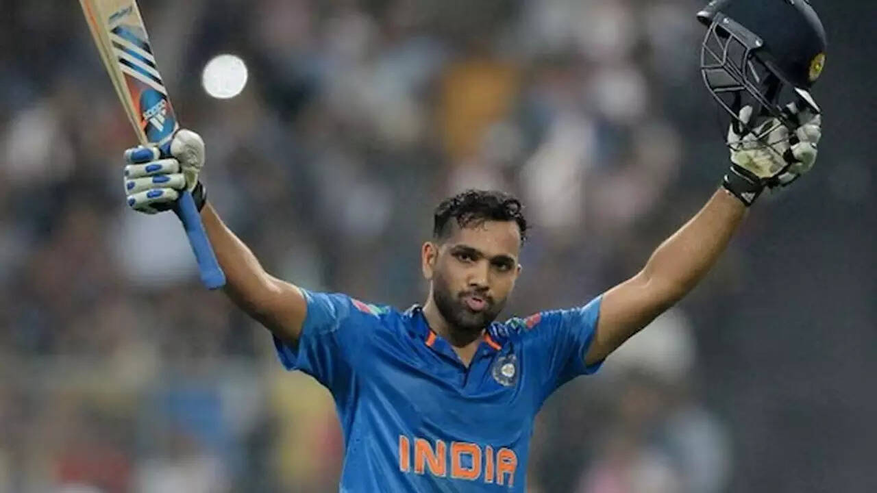 "Rohit Sharma celebrates after scoring a record-breaking 264 runs in an ODI against Sri Lanka at Eden Gardens"  🔹 Titl