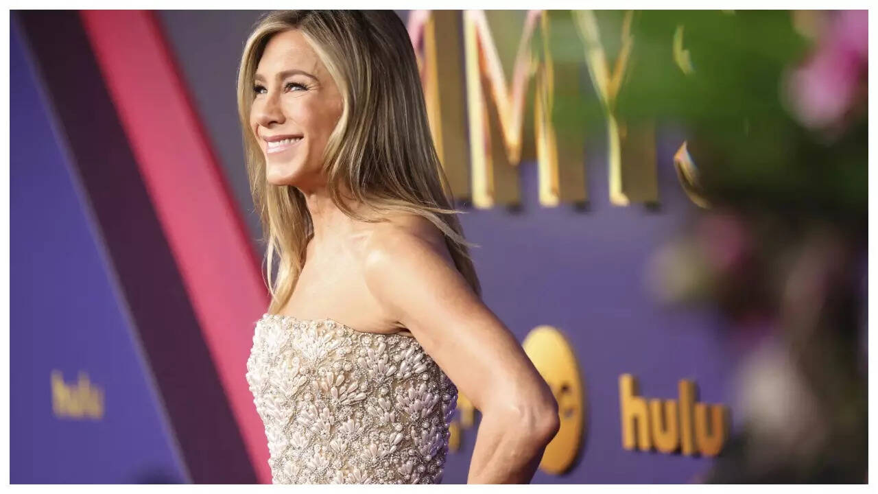 jennifer aniston champagne dress Jennifer Aniston Stuns in Champagne Gown at 2024 Emmy Awards Red Carpet