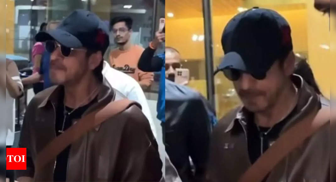 Shah Rukh Khan stuns in a brown leather jacket as he arrives in Mumbai- Video inside | Hindi Movie News