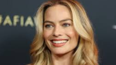 Margot Robbie strolls with baby bump, following 'The Sims' film adaptation news