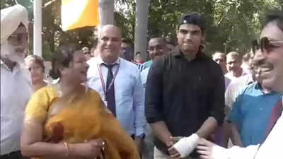 Watch: Neeraj Chopra, with his fractured hand in a plaster, gets a grand welcome on return home