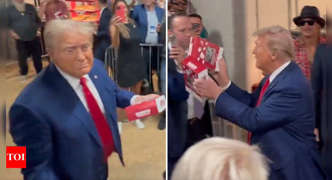 Watch: Trump throws popcorn at the stadium crowd, who chant “USA” as he enters