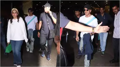 Shah Rukh Khan makes a splash at Mumbai airport as he returns from Abu Dhabi