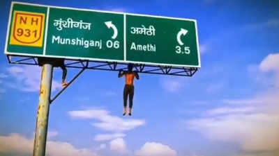 Video of man doing pull-ups on signboard goes viral, UP police responds