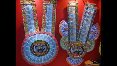 Money garlands await human tigers