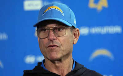 What happened to Chargers coach Jim Harbaugh when he missed part of the Chargers' win over the Broncos?