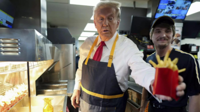 'Worked 15 minutes more than Kamala ... ' Trump visits McDonald's in Philadelphia; works the frier