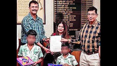 Two minor, orphaned siblings adopted by a Canadian couple