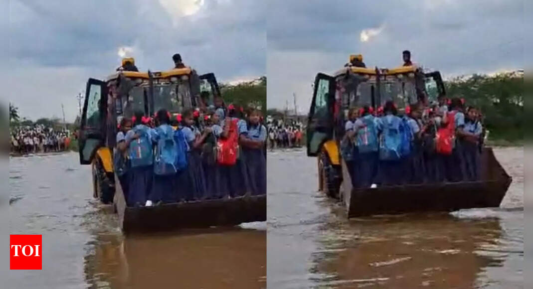 JCB ferries girl students across submerged bridge in Karnataka's ...