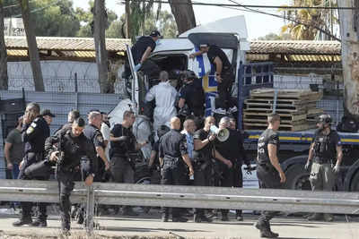 One dead, 40 injured as truck rams a bus stop near Mossad HQ in Tel Aviv