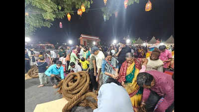 Visitors throng Bali Yatra to get a piece of Puri chariot ropes