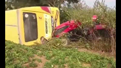 2 kids hurt as school bus swerves to avoid tractor