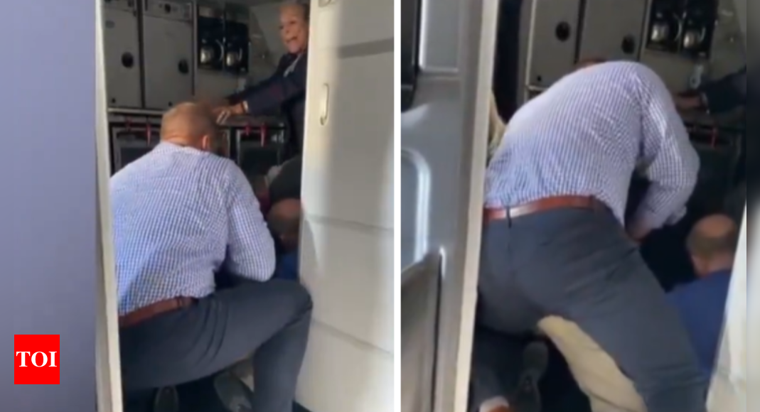 Watch: Passengers duct-tape man who demanded to exit American Airlines flight midair – Times of India