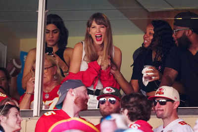 What did Taylor Swift gift her fans at the NFL match yesterday?