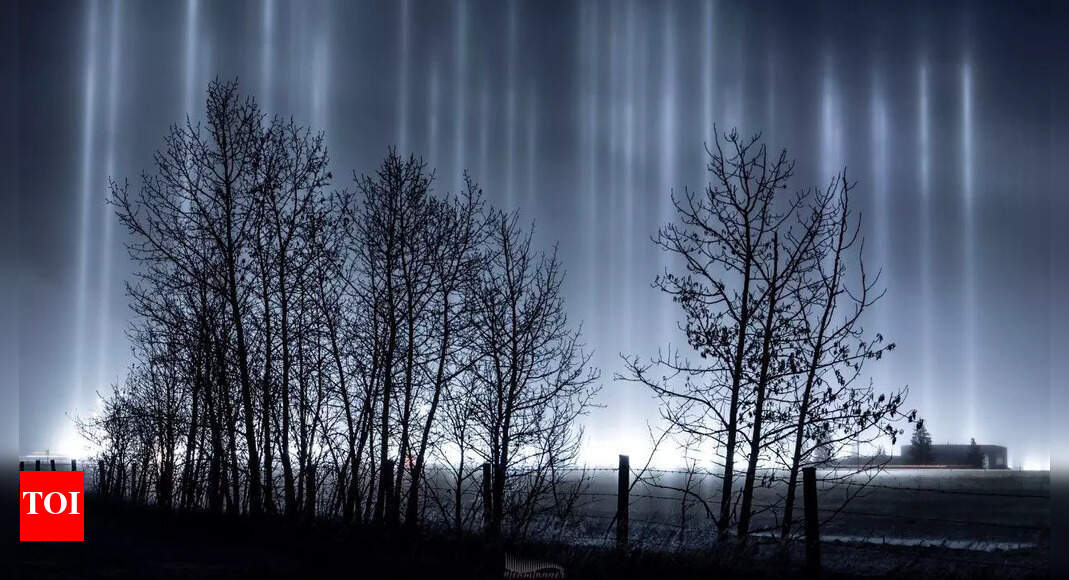 Light pillars' illuminate the night sky in Canada's Alberta. All