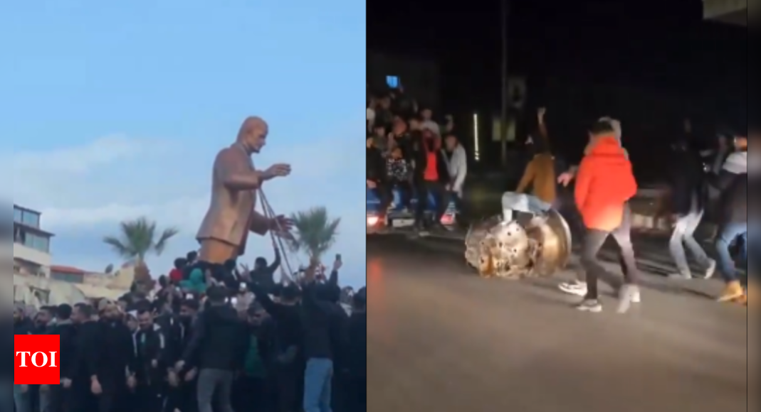 Watch: Syrians drag President Bashar al-Assad's father's statue on streets in celebration