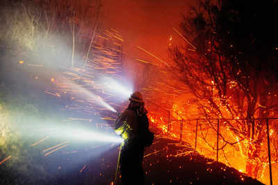 Malibu wildfire is raging out of control as dry winds fan flames