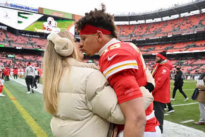 Brittany Mahomes' game-day fashion turns heads in cream puffer and luxe prada earmuffs at Chiefs-Browns match