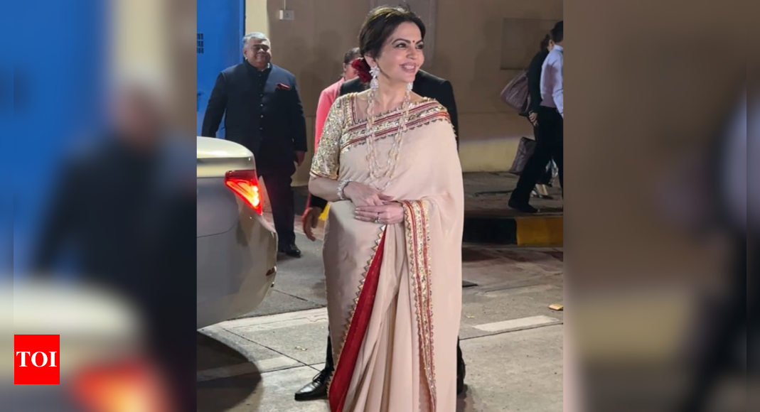 Nita Ambani keeps it classic in a red and cream sari acing her signature style