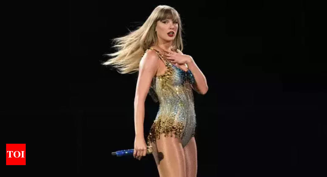 Taylor Swift attends Travis Kelce's game in a luxurious long red coat, joined by her parents at Arrowhead Stadium