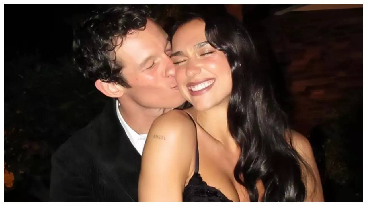 Dua Lipa ENGAGED to Callum Turner after a year of dating; singer shows off STUNNING ring - Pics Inside | - The Times of India