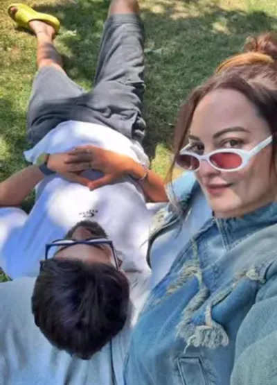 Zaheer Iqbal rests his head on Sonakshi's lap as they soak in sun