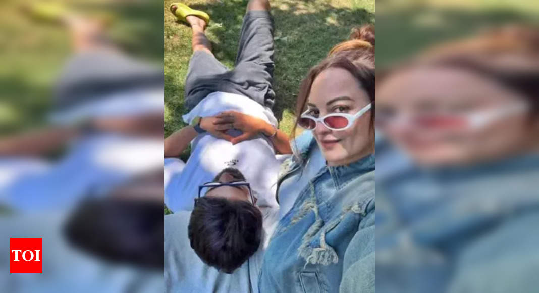 Zaheer Iqbal rests his head on Sonakshi's lap as they soak in sun