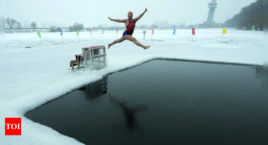 In freezing temperatures, swimmers in China plunge right into a river for well being and pleasure – Times of India